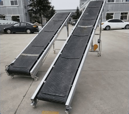 Băng tải nâng hạ lên ô tô Container